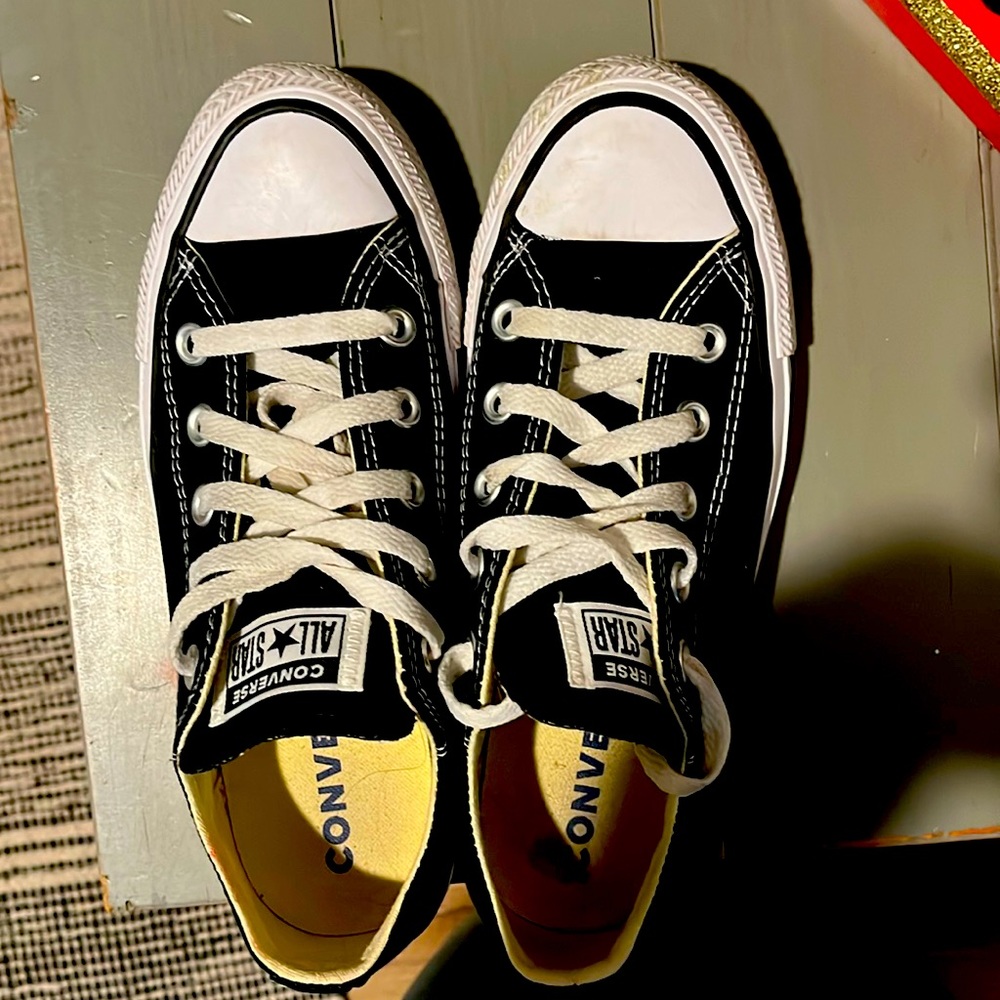 Black low top Converse sneakers